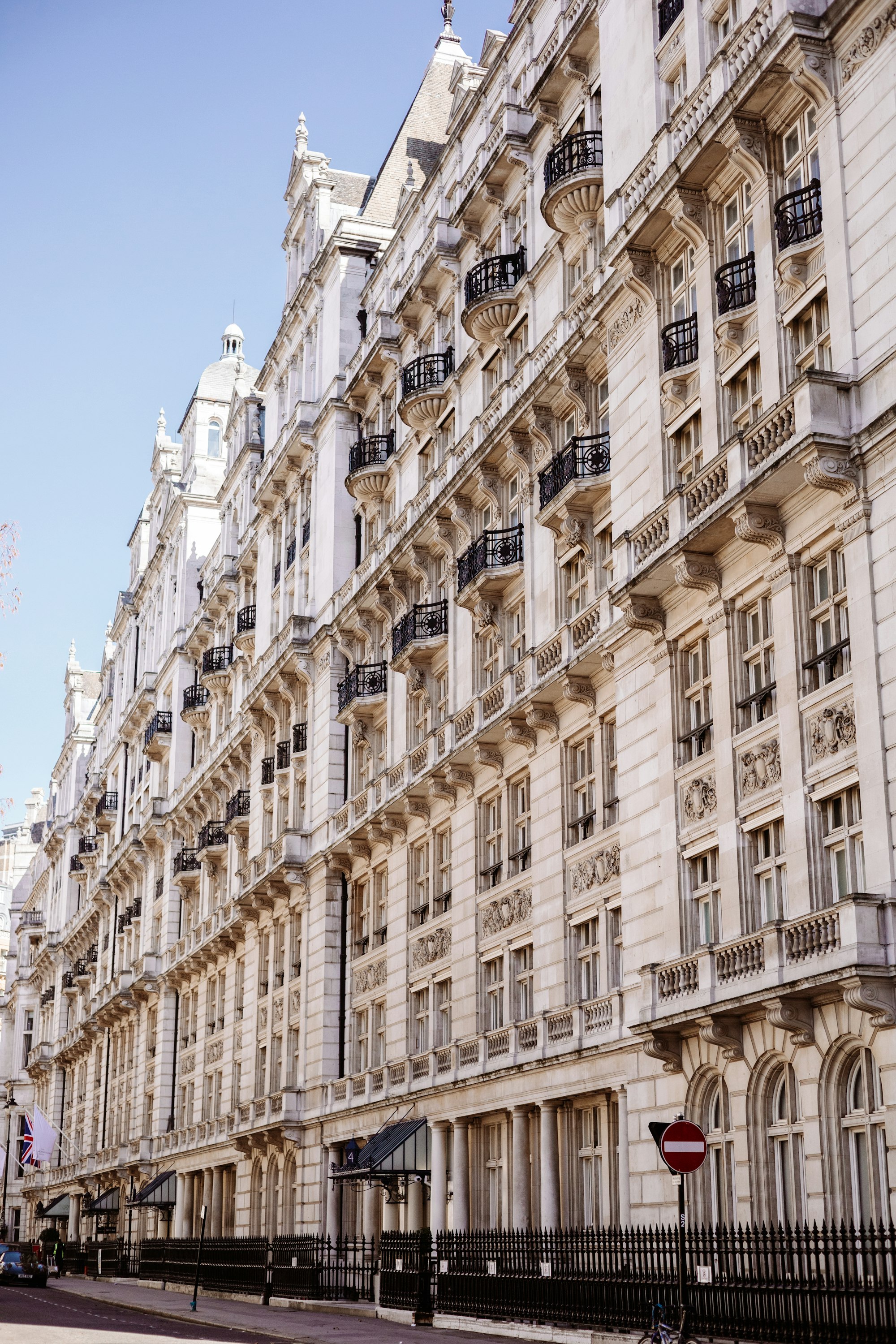 Grand white stucco terrace in Prime Central London on a bright day